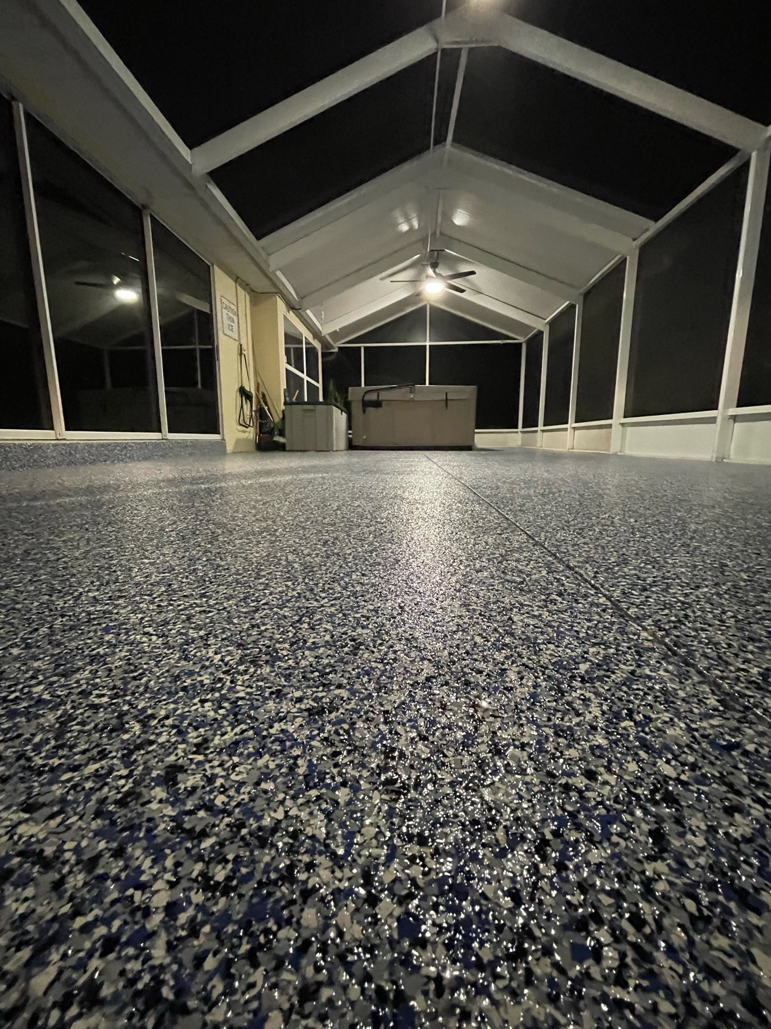 Completed Grey, White, and Black Flake Garage Flooring