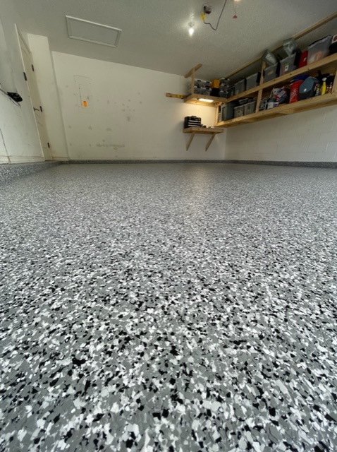 Completed Grey, White and Black Flake Garage Flooring