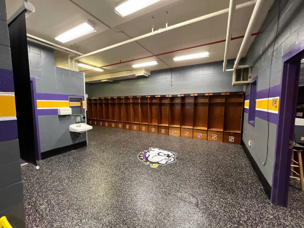 Complete concrete coated floors for a school gym