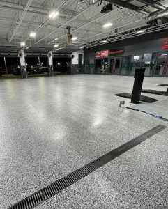 Commercial Car Dealership Flooring Application by Titan Garage Flooring Solutions